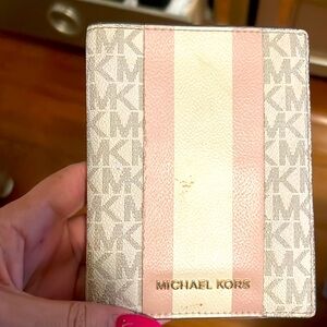 Michael Kors wallet with billfold, credit card slots snd license window.